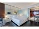 Modern bedroom with a sleek layout featuring mirrored wall behind the bed and a kitchenette at 4381 W Flamingo Rd # 3818, Las Vegas, NV 89103