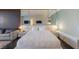 Inviting bedroom with a king bed, mirrored headboard, and modern decor at 4381 W Flamingo Rd # 3818, Las Vegas, NV 89103
