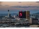 Panoramic city skyline view with prominent landmarks and mountainous backdrop, captured during a twilight sky at 4381 W Flamingo Rd # 3818, Las Vegas, NV 89103