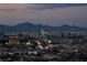 Nighttime view of the illuminated Las Vegas skyline with mountain backdrop at 4381 W Flamingo Rd # 3818, Las Vegas, NV 89103