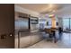 Contemporary kitchen featuring stainless steel appliances, bar seating, and a stylish, minimalist design at 4381 W Flamingo Rd # 3818, Las Vegas, NV 89103