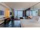 Modern living area features a bed, TV, desk, and city view in this luxurious condo at 4381 W Flamingo Rd # 3818, Las Vegas, NV 89103