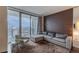 Bright living room with plush seating and a view of the city skyline at 4381 W Flamingo Rd # 3818, Las Vegas, NV 89103