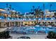 Resort-style pool with luxurious daybeds and palm trees, creating a tranquil and upscale atmosphere at 4381 W Flamingo Rd # 3818, Las Vegas, NV 89103