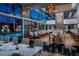 Elegant restaurant with a view of the pool, featuring modern decor and stylish seating arrangements at 4381 W Flamingo Rd # 3818, Las Vegas, NV 89103