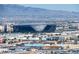 A daytime view of Allegiant Stadium and cityscape with mountain backdrop at 4381 W Flamingo Rd # 3818, Las Vegas, NV 89103