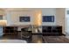 Modern office and work area with built in desk, dark wood floors and storage shelving at 4381 W Flamingo Rd # 3818, Las Vegas, NV 89103