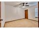 A carpeted bedroom features a ceiling fan and a window at 5242 Dickens Dr, Las Vegas, NV 89119