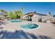 Community pool and hot tub with surrounding lounge area for relaxing and enjoying the outdoors at 5242 Dickens Dr, Las Vegas, NV 89119