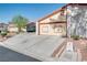 A long driveway leading to a two-car garage in a well maintained community at 5242 Dickens Dr, Las Vegas, NV 89119