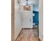 Bright entryway featuring modern light fixture, natural wood flooring and neutral wall paint at 5242 Dickens Dr, Las Vegas, NV 89119