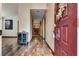 Inviting entry with wood-look flooring, a modern storage cabinet, and views of the living area at 5242 Dickens Dr, Las Vegas, NV 89119