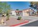 Charming single-story home with desert landscaping and a spacious driveway on a sunny day at 5242 Dickens Dr, Las Vegas, NV 89119