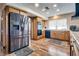 Well-equipped kitchen with stainless steel refrigerator and a convenient layout, making meal preparation enjoyable at 5242 Dickens Dr, Las Vegas, NV 89119