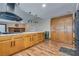 Open kitchen with a breakfast bar overlooking the fireplace, creating a warm and inviting atmosphere for cooking at 5242 Dickens Dr, Las Vegas, NV 89119