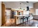 Spacious kitchen featuring a breakfast bar, stainless steel appliances, and ample cabinet space, perfect for cooking at 5242 Dickens Dr, Las Vegas, NV 89119