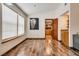 Well-lit living room boasts wood floors and an elephant artwork, creating a stylish and comfortable atmosphere at 5242 Dickens Dr, Las Vegas, NV 89119