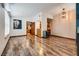 Inviting living room featuring beautiful wood floors and an open doorway, providing an airy and connected living space at 5242 Dickens Dr, Las Vegas, NV 89119