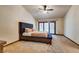 Spacious main bedroom with a ceiling fan, carpet flooring and walk out access at 5242 Dickens Dr, Las Vegas, NV 89119