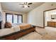 Spacious main bedroom featuring a ceiling fan and natural light at 5242 Dickens Dr, Las Vegas, NV 89119