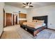 Spacious main bedroom featuring built in storage, carpet flooring, and a ceiling fan at 5242 Dickens Dr, Las Vegas, NV 89119
