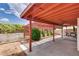 Covered backyard patio with string lights and barbecue area at 5242 Dickens Dr, Las Vegas, NV 89119