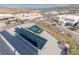 Aerial view showcasing a stunning house with a pool and outdoor lounge area, set against a scenic neighborhood at 53 Falling Ridge Ln, Henderson, NV 89011