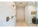 Modern walk-in shower with dual shower heads, bench seating, and designer tile at 53 Falling Ridge Ln, Henderson, NV 89011