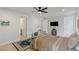 Bright bedroom with carpet floors, three doors, ceiling fan, and a decorated bed at 53 Falling Ridge Ln, Henderson, NV 89011
