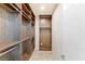 Walk-in closet featuring custom shelving and storage at 53 Falling Ridge Ln, Henderson, NV 89011