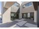 This modern home features a beautiful courtyard offering an additional outdoor living space at 53 Falling Ridge Ln, Henderson, NV 89011