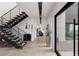 Inviting entryway with modern staircase and stylish decor at 53 Falling Ridge Ln, Henderson, NV 89011