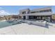 Expansive view of a modern home exterior featuring a pool, lounge area, and architectural design at 53 Falling Ridge Ln, Henderson, NV 89011