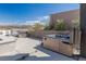Outdoor hot tub with a built-in grill, offering a private and serene retreat with mountain views at 53 Falling Ridge Ln, Henderson, NV 89011