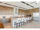 Bright, open kitchen with stainless steel appliances, large island, and seating for casual dining at 53 Falling Ridge Ln, Henderson, NV 89011