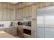 Close-up of the modern kitchen featuring stainless steel appliances and plenty of storage space at 53 Falling Ridge Ln, Henderson, NV 89011