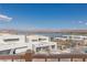 Scenic lake view from a modern home with balconies and contemporary architectural design at 53 Falling Ridge Ln, Henderson, NV 89011