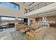 This open-concept living room features floor to ceiling windows and access to the kitchen at 53 Falling Ridge Ln, Henderson, NV 89011