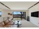 Upstairs living room with comfortable seating and patio with a spiral staircase with views at 53 Falling Ridge Ln, Henderson, NV 89011