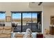 Bright living room showcases access to an outdoor living space, offering amazing views at 53 Falling Ridge Ln, Henderson, NV 89011