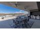Spacious patio with a complete outdoor kitchen, dining area, and mountain views, perfect for entertaining at 53 Falling Ridge Ln, Henderson, NV 89011
