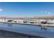 The infinity pool features water bowls with fire, offering stunning views of the mountains and lake at 53 Falling Ridge Ln, Henderson, NV 89011