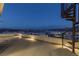 Spacious rooftop deck with spiral staircase offering panoramic views of the surrounding lake and community at 53 Falling Ridge Ln, Henderson, NV 89011