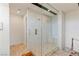 Walk-in shower with dual shower heads, bench seating and clear glass enclosure at 53 Falling Ridge Ln, Henderson, NV 89011