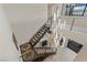 Modern staircase with contemporary lighting and decorative rugs at the base of the stairs at 53 Falling Ridge Ln, Henderson, NV 89011