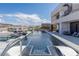 Modern outdoor swimming pool with sun loungers and stylish landscaping, perfect for relaxation at 53 Falling Ridge Ln, Henderson, NV 89011