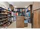 Spacious walk-in closet with custom shelving and drawers for ample storage at 53 Falling Ridge Ln, Henderson, NV 89011