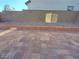 Paver patio and backyard featuring a gravel landscaped wall at 5817 Bonita Rose St, Las Vegas, NV 89113