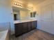 Bathroom featuring a double vanity, and modern finishes, offering a serene and stylish space at 5817 Bonita Rose St, Las Vegas, NV 89113