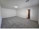 Large bedroom with carpet and neutral colored walls and bathroom at 5817 Bonita Rose St, Las Vegas, NV 89113